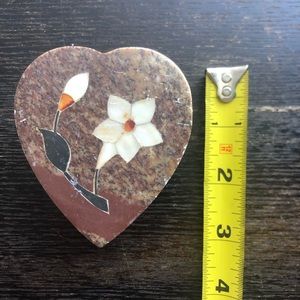 Stone heart-shaped box with flower